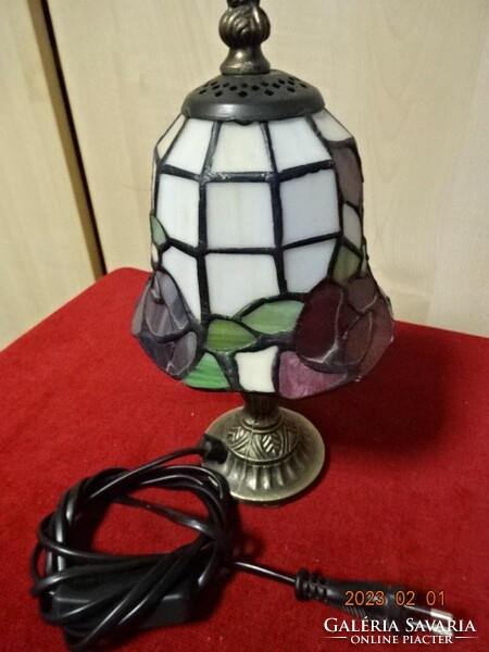 Tiffany glass table lamp with bronze base. He has! Jokai.