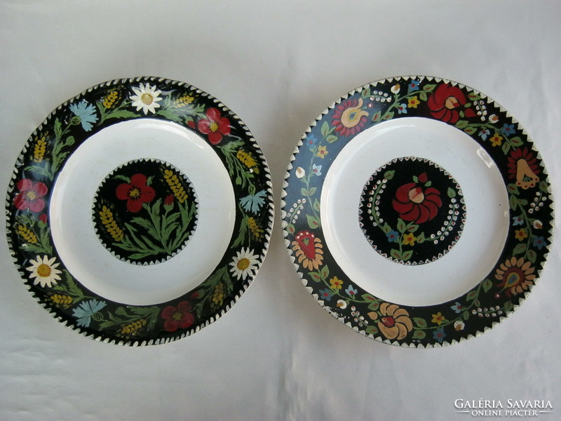 2 decorative ceramic plates with folk flower motifs, hand painting is defective