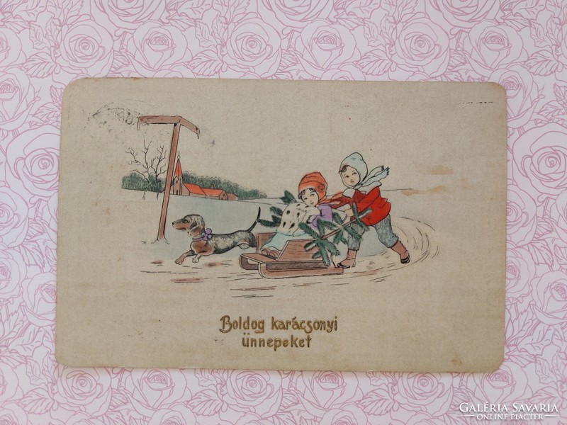 Régi karácsonyi képeslap 1912 levelezőlap gyerekek szánkó tacsi