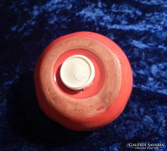 Lifelike ceramic salt shaker in the shape of a tomato