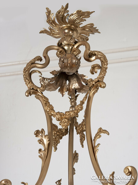 Gilded bronze chandelier with angel figure and crystal pendants