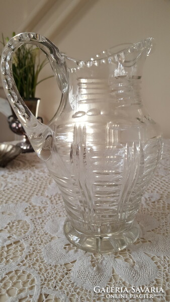 Old, engraved thick crystal water jug