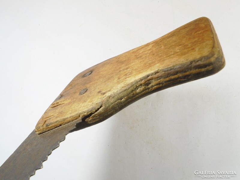 Old handsaw wooden saw riveted, wooden handle