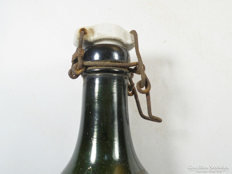Antique old buckled glass bottle with dew water inscription and Hungarian royal crown coat of arms