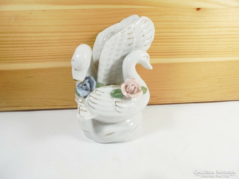 Retro old porcelain swan figure sculpture