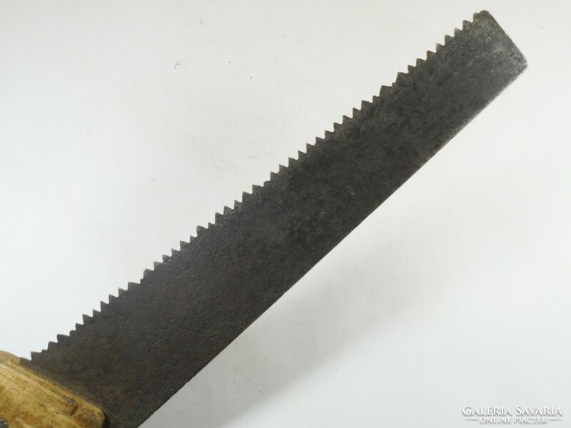 Old handsaw wooden saw riveted, wooden handle