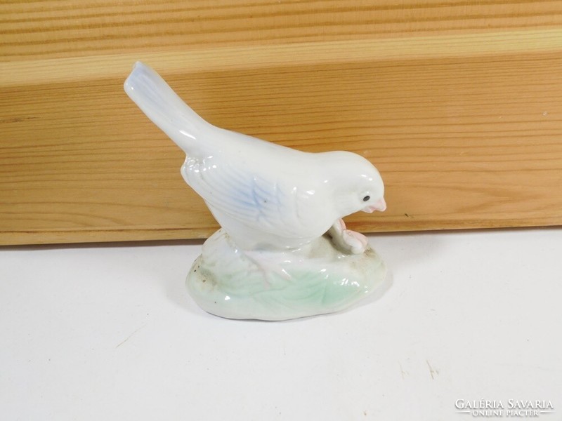 Retro old porcelain bird figure sculpture