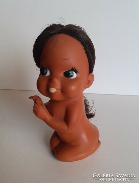 Old rare gesturing rubber doll with braided hair