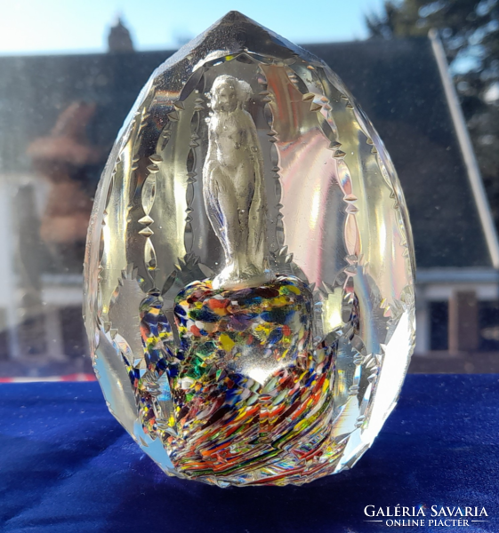 Old hand-polished paperweight with a female figure