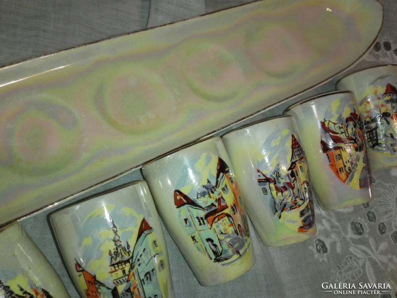 On a tray of eosin, hand-painted porcelain brandy set.