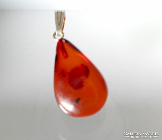 Small amber pendant with silver hanger