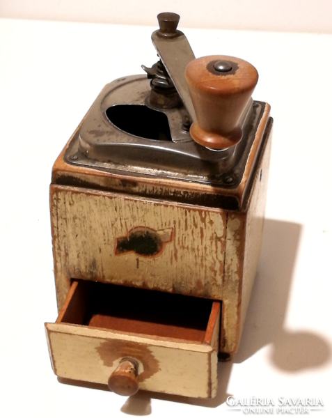 Old coffee grinder with wooden drawer