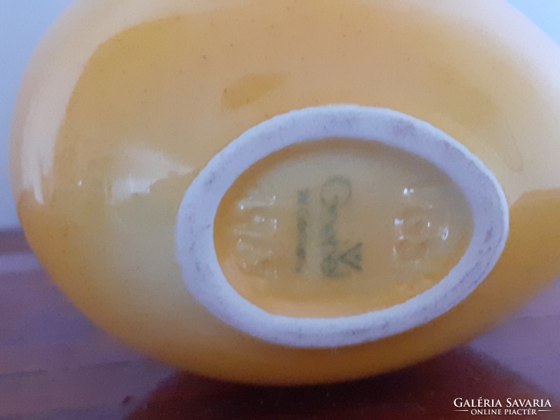 Old goebel eggs in ikebana mini yellow vase