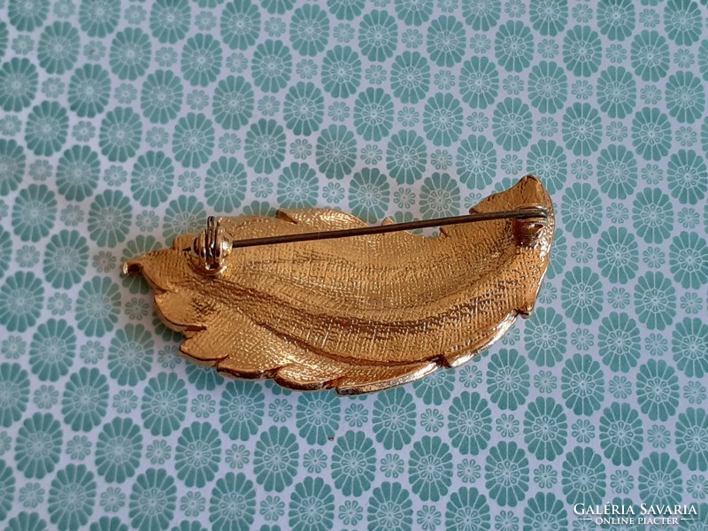Vintage leaf shaped female brooch with old metal badge
