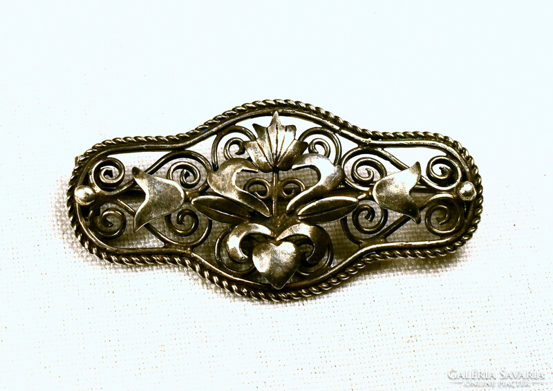 Historizing decorative old silver brooch