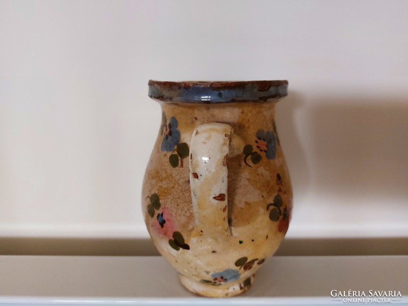 Old glazed tile jar with floral folk little jam bastard