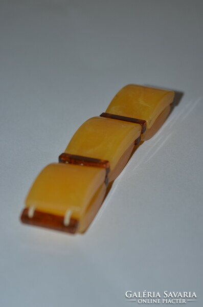 Plastic bracelet with amber effect