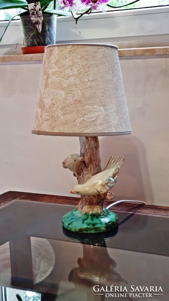 Old, bird-like, ceramic table lamp, assembled, with a greenish, mottled shade, complete. (4.)