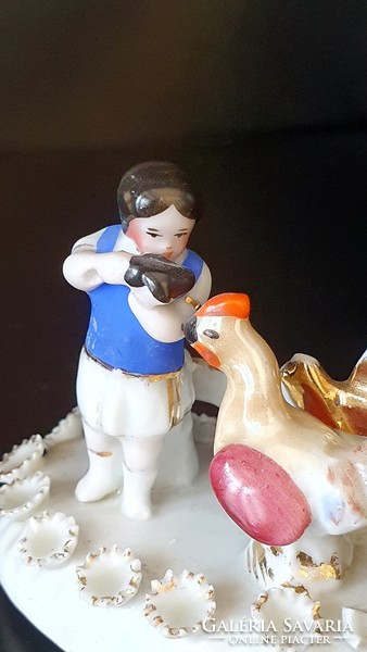 Antique mini German porcelain little girl with cock. Injured. 6 cm high.