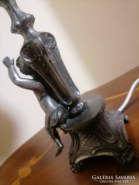 Antique pewter lamp with putto