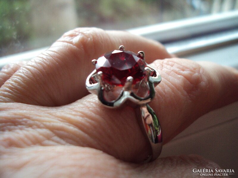 Silver ring with a huge burgundy stone