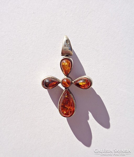 Silver cross with amber stones