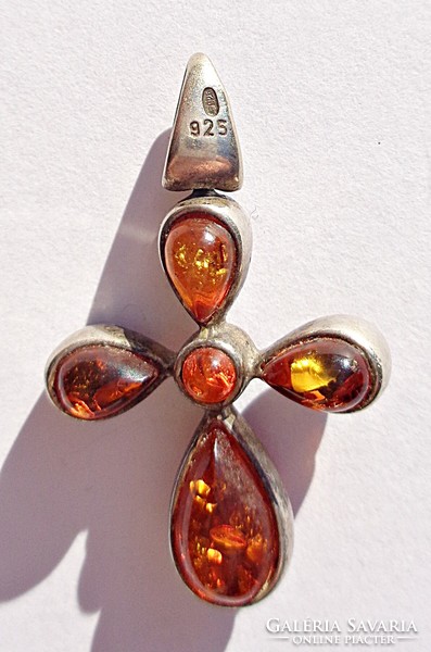 Silver cross with amber stones