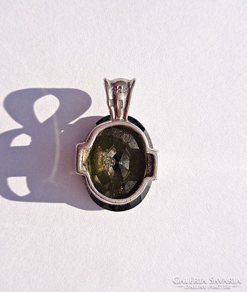 Large polished silver pendant with green stones