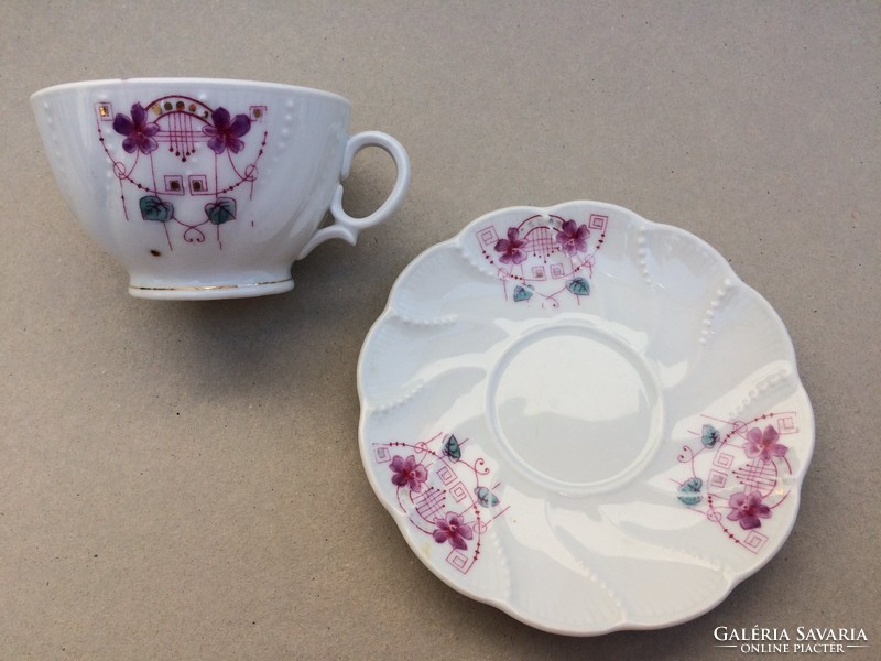 Old porcelain coffee cup with art nouveau floral pattern