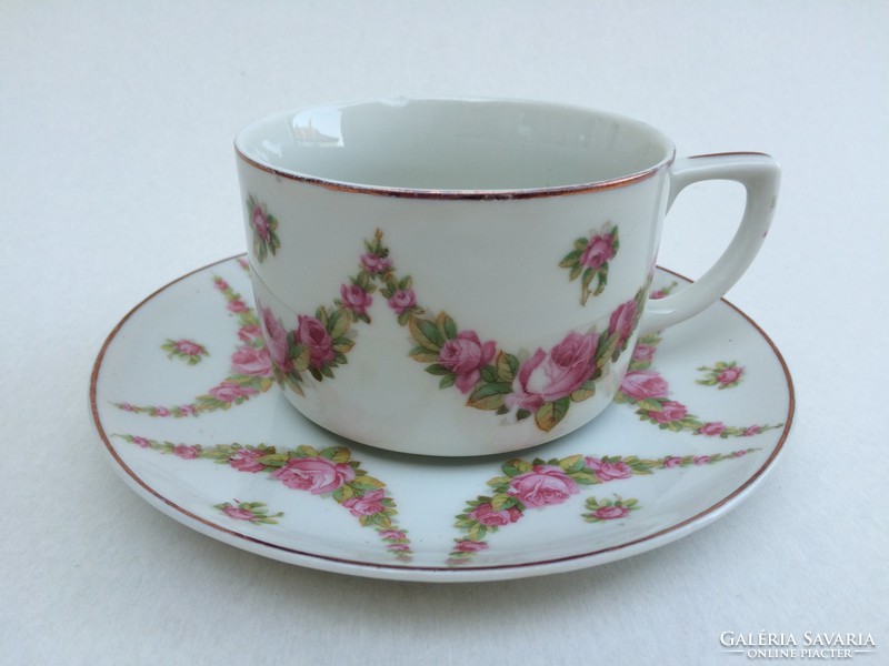 Old porcelain cup with Art Nouveau rose garland tea mug