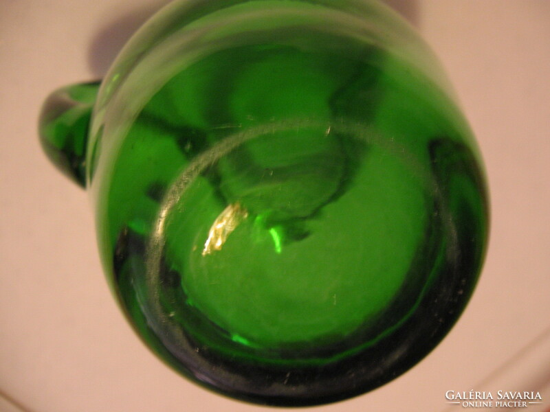 Small green blown glass jug