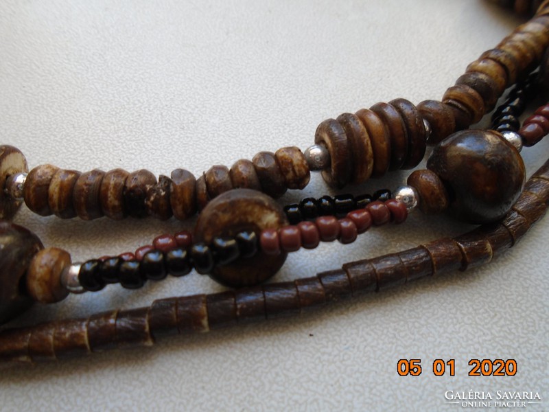 3-row necklace with brown shades of mistletoe beads with a large wood and bone layered pendant