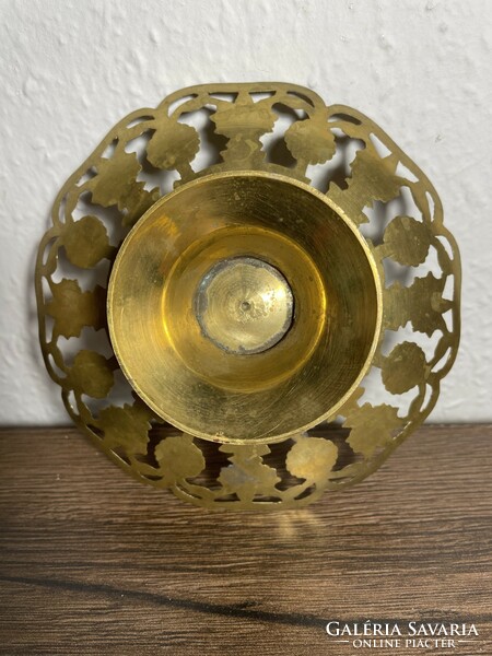 Old copper bowl with an openwork pattern