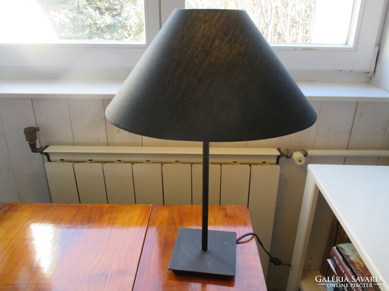 Black, bone-colored inside, table lamp shade that directs the light flawlessly