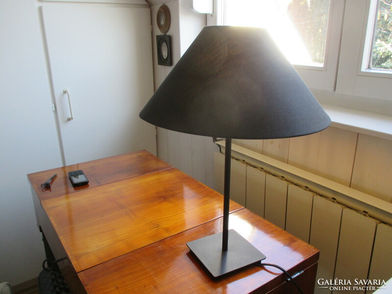 Black, bone-colored inside, table lamp shade that directs the light flawlessly