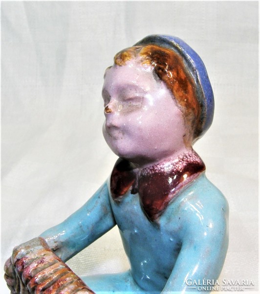 Ceramic figurine of a boy with an accordion