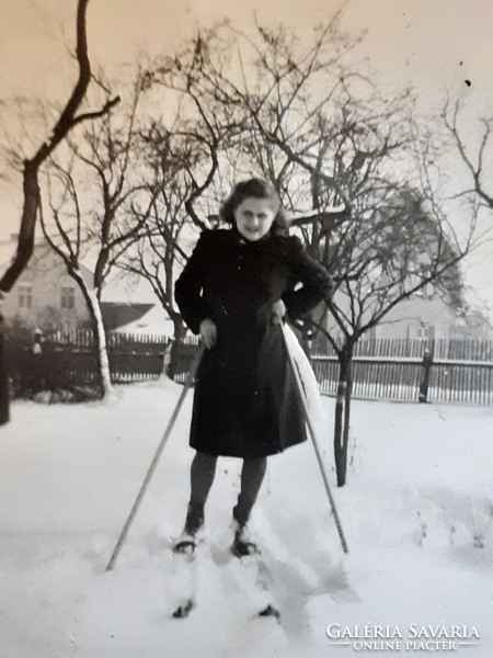 Old female photo circa 1940 with vintage winter photo skis