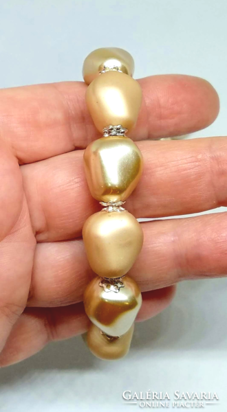 Tekla matte and shiny gold pebble pearl bracelet and earring set