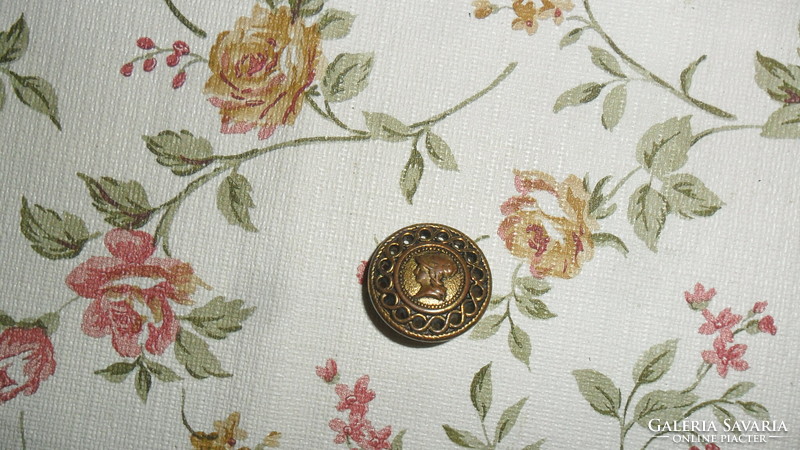 Older metal, bronze-colored button with cameo ear, 2 cm. Tailoring and sewing for creative purposes.