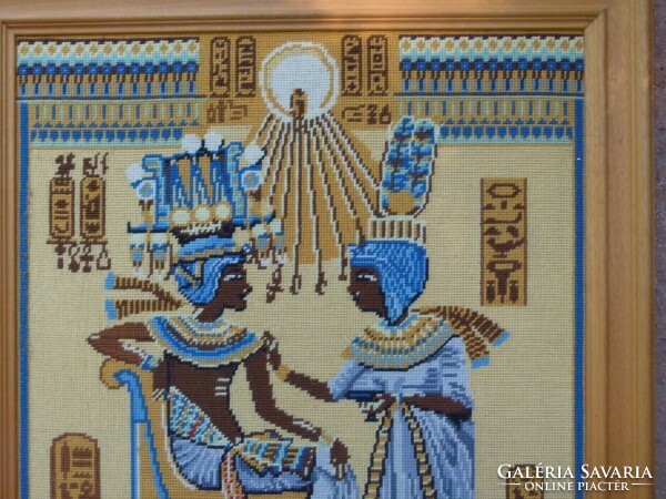 Tapestry depicting Egyptian figures in a solid wood frame