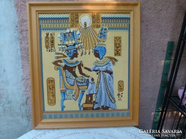 Tapestry depicting Egyptian figures in a solid wood frame