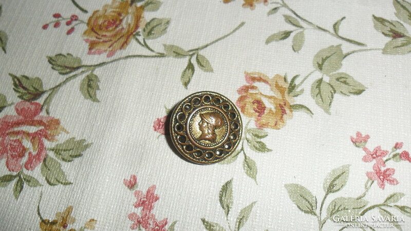 Older metal, bronze-colored button with cameo ear, 2 cm. Tailoring and sewing for creative purposes.