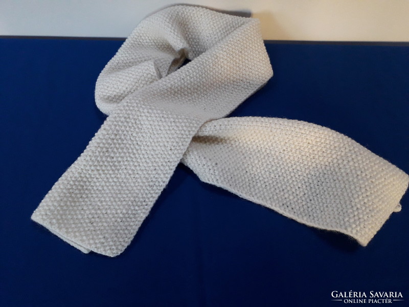 Hand-knitted, off-white scarf