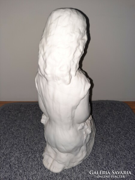 White ceramic girl statue