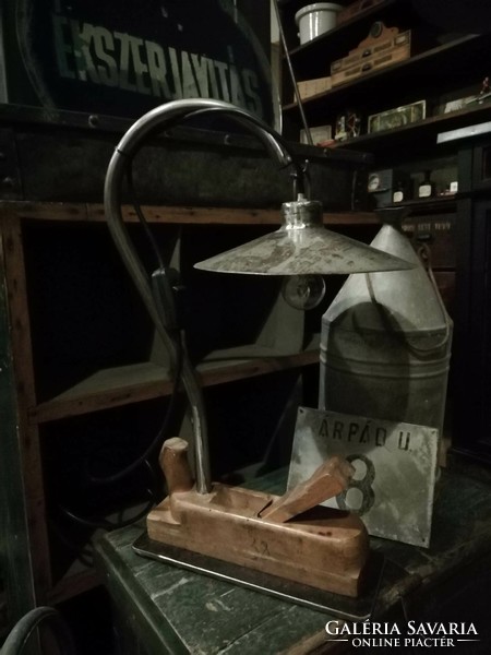 A custom-made lamp in an industrial style, a bedside lamp with a patina by combining metal and a planer