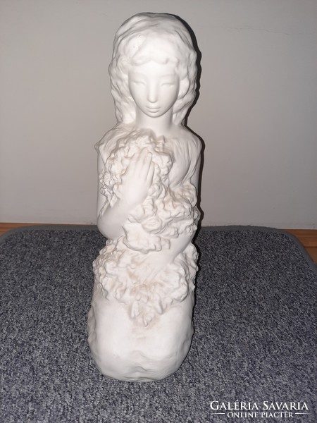 White ceramic girl statue