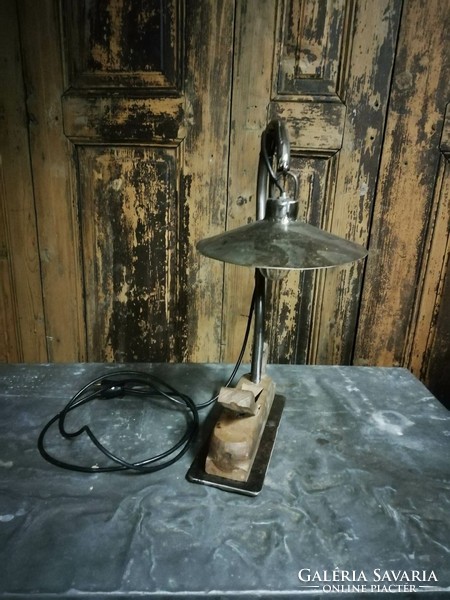 A custom-made lamp in an industrial style, a bedside lamp with a patina by combining metal and a planer