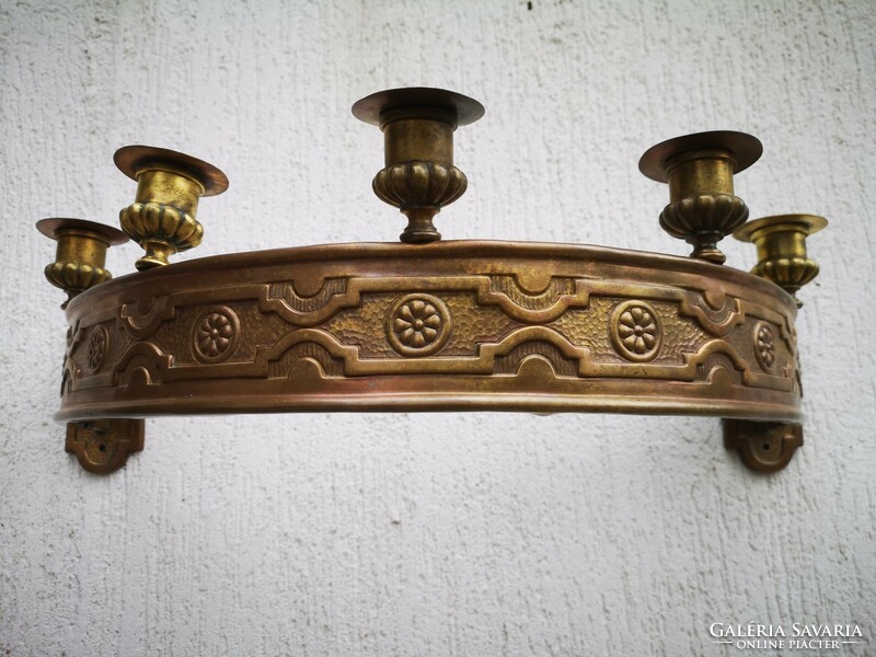 Antique wall candle holder made of copper. Elegant decorative ornate special piece