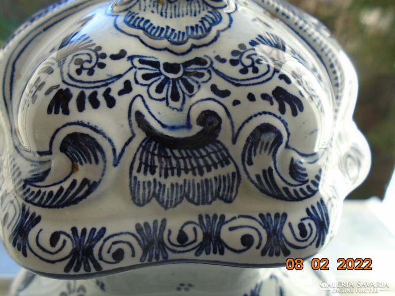 19th century vase with rich hand-painted cobalt blue patterns, embossed lidded landscape