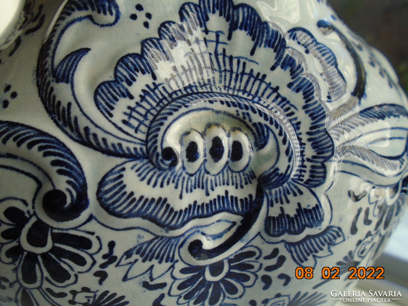 19th century vase with rich hand-painted cobalt blue patterns, embossed lidded landscape